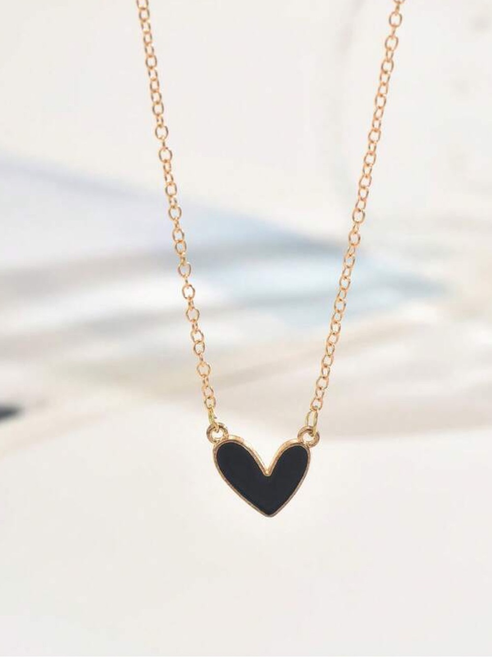 NWOT Gold Chain Necklace with Black Heart Pendant